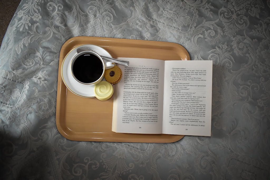 coffee and book in bed